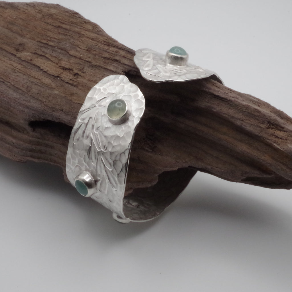 This reclaimed Sterling Silver forged and stamped bangle with rutilated quartz and chalcedony cabochons with flowing waterweed design is inspired by Kent Chalk Streams. It is hand stamped using tools made by me from vintage reclaimed tool steel.