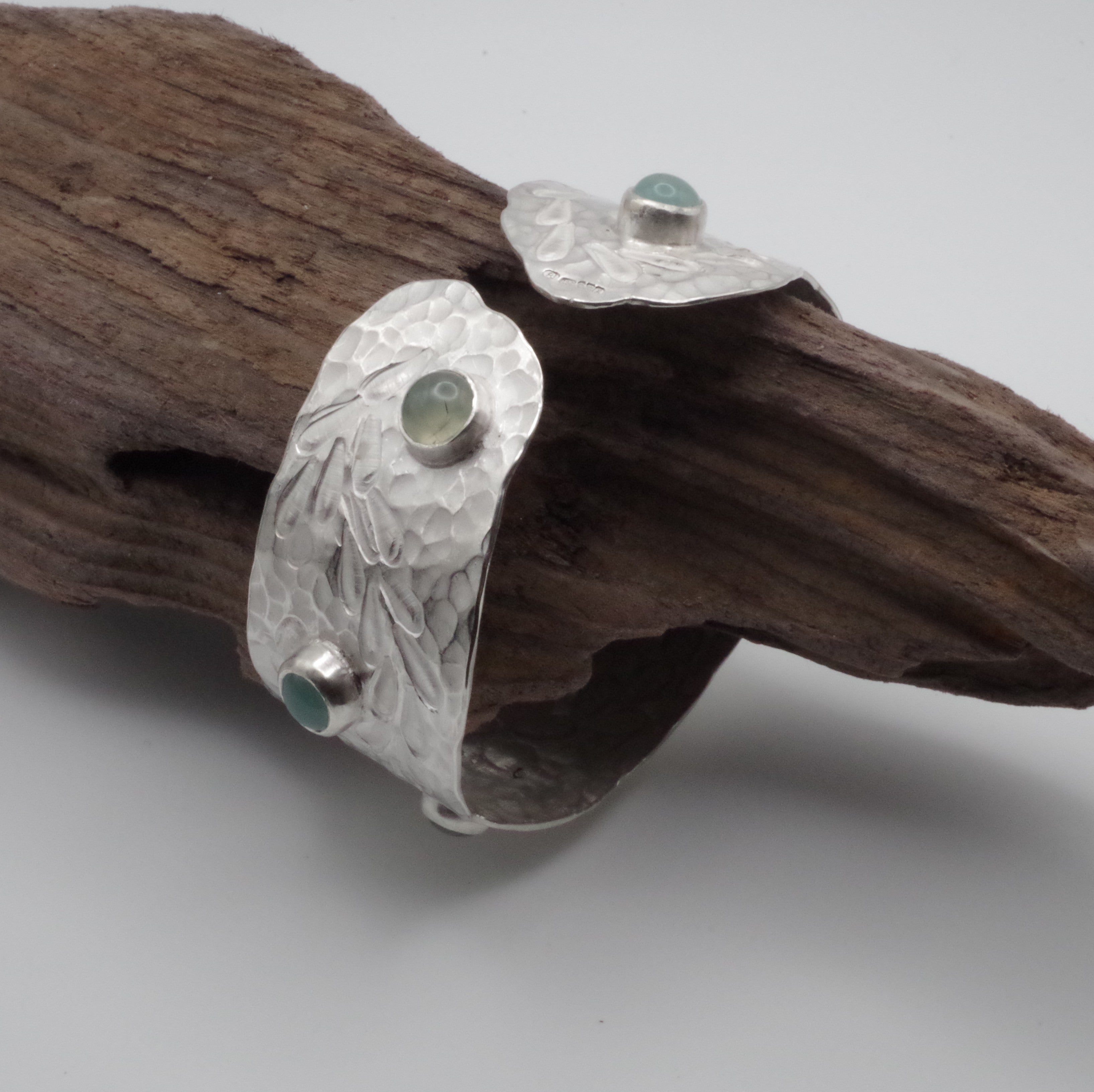 This reclaimed Sterling Silver forged and stamped bangle with rutilated quartz and chalcedony cabochons with flowing waterweed design is inspired by Kent Chalk Streams. It is hand stamped using tools made by me from vintage reclaimed tool steel.