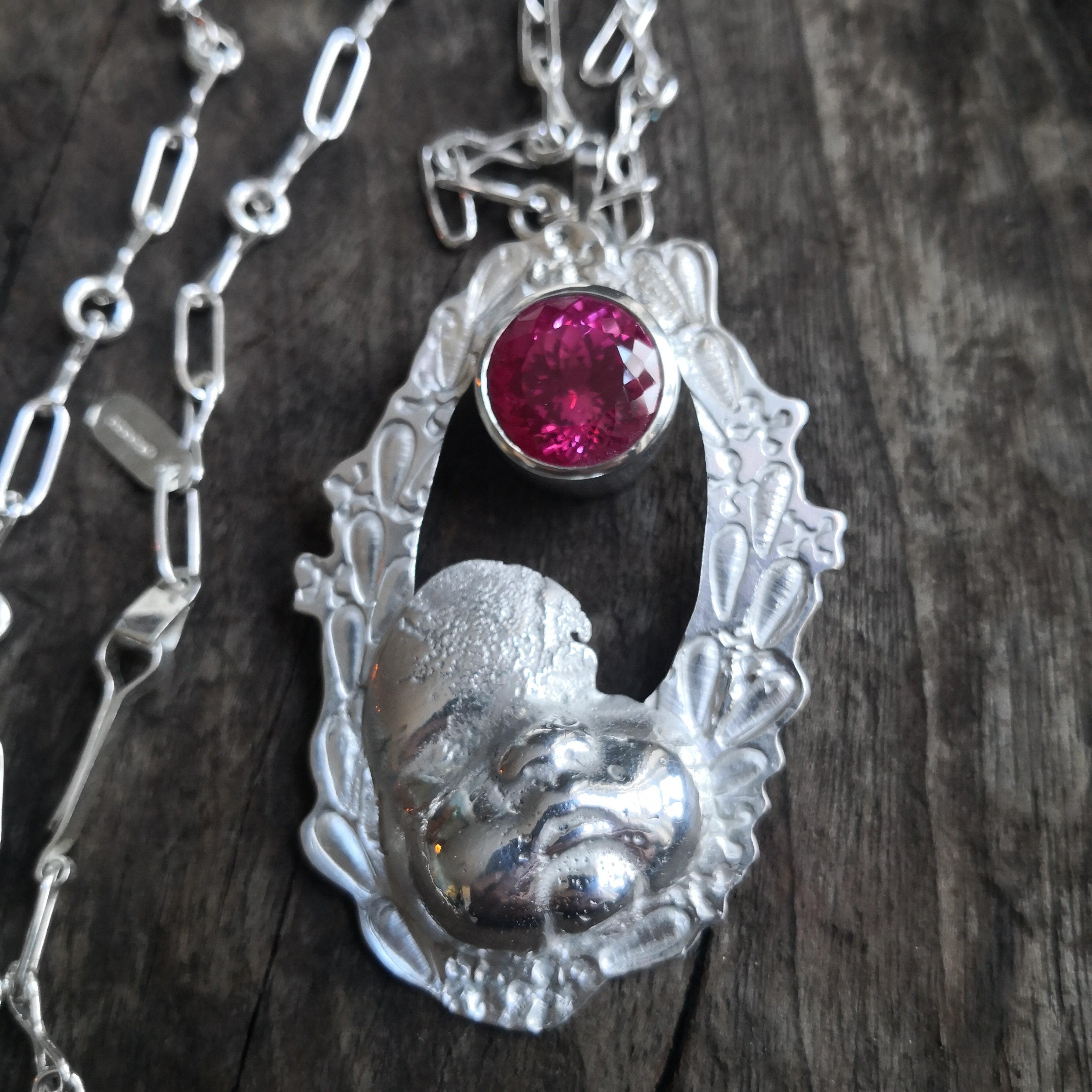 "Cherub thinks in pink sparkles" - Cherub pendant with large pink sapphire